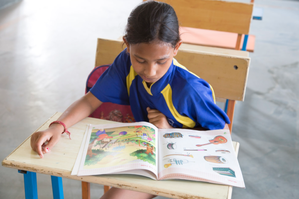 This little girl is getting an education thanks to the work of Apneaap.  